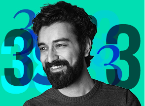Man smiling in front of a number 3 graphical background