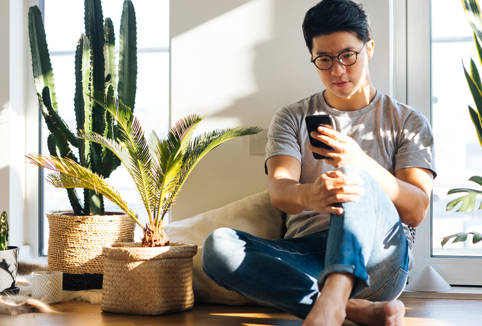 Man looking down at mobile phone