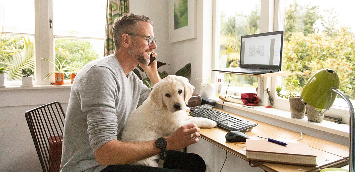 Man smiling with a dog