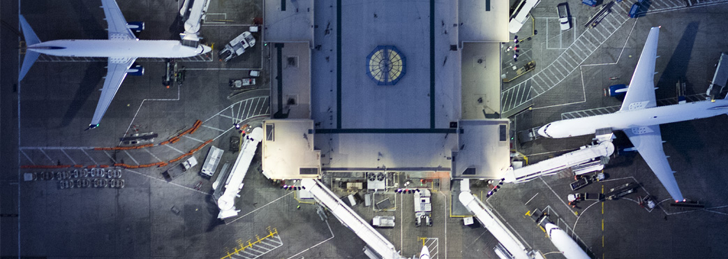 Image of planes docking in an airport from above