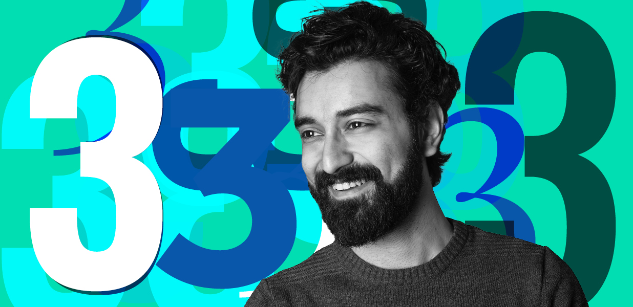 Man smiling infront of a number 3 graphical background