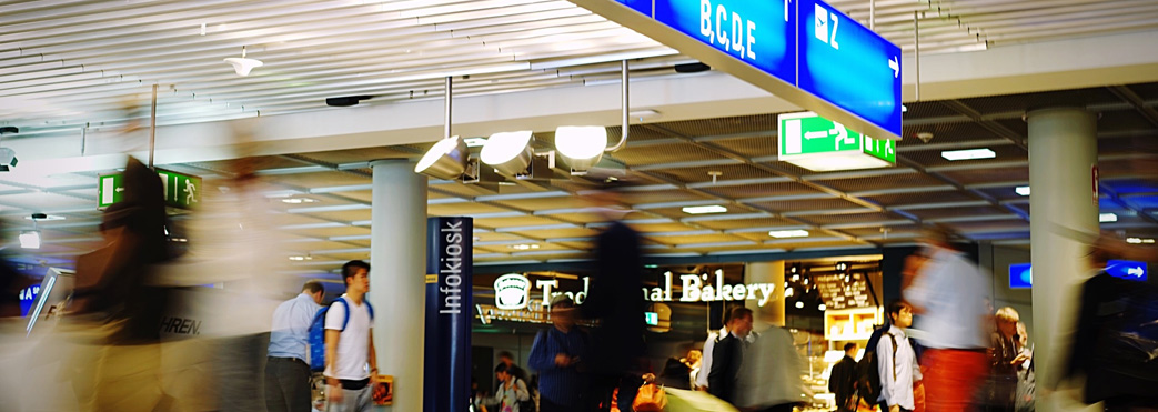 Image of passengers outside airport shops