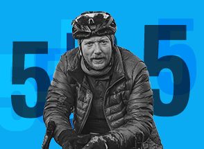 Man on bike with number 5 graphical background