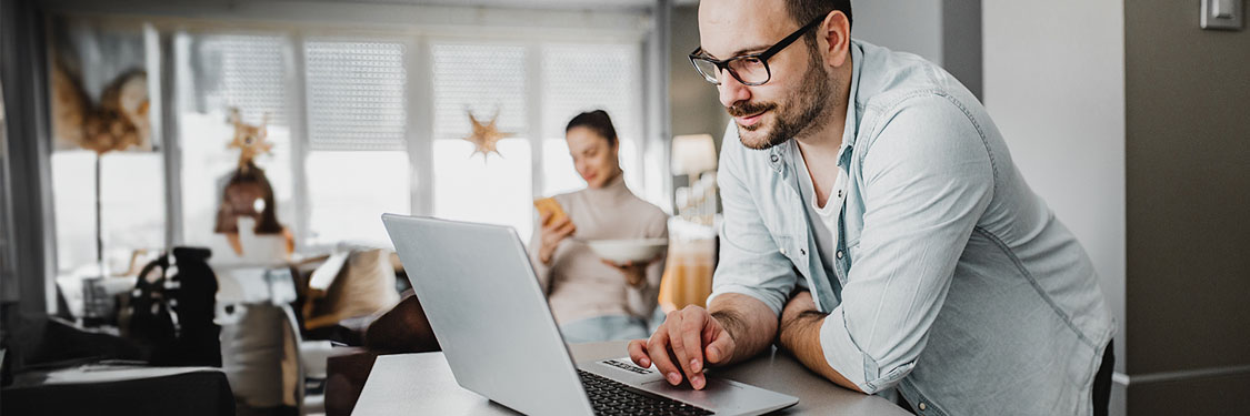 man looking at a laptop